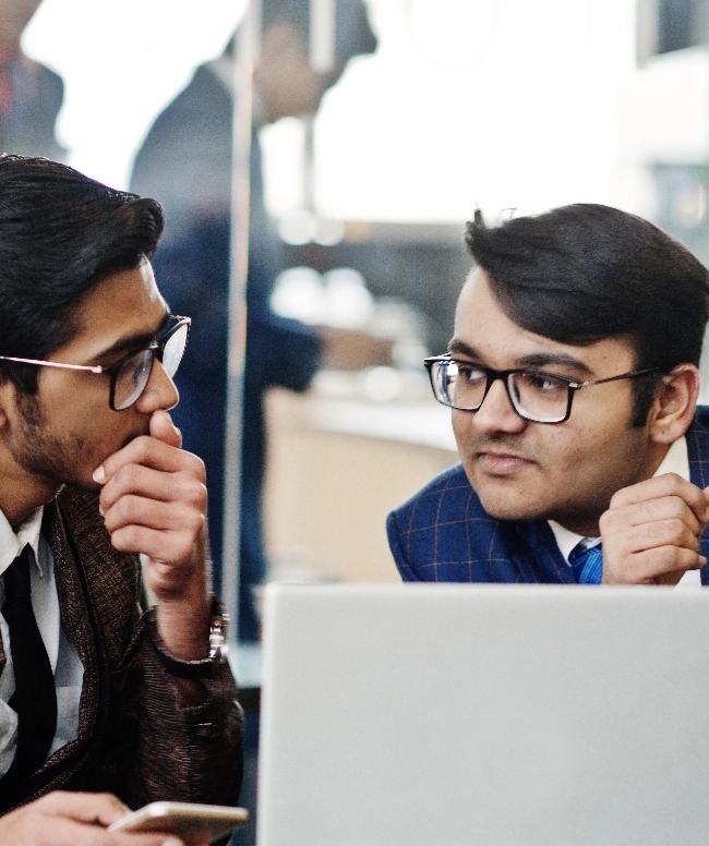 two-indian-business-man-suits-sitting-office-cafe-looking-laptop@2x (4)